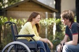Man, Woman in wheelchair