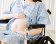 Pregnant woman in wheelchair